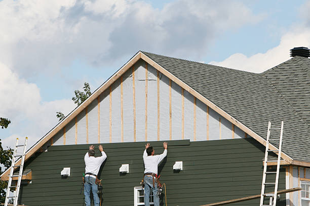 Professional Siding Installation technician working in Cortland, NY